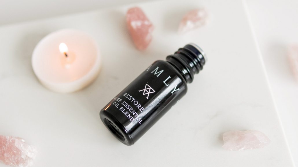 AMLY essential oil blends and room fragrances with rose quartz crystals.