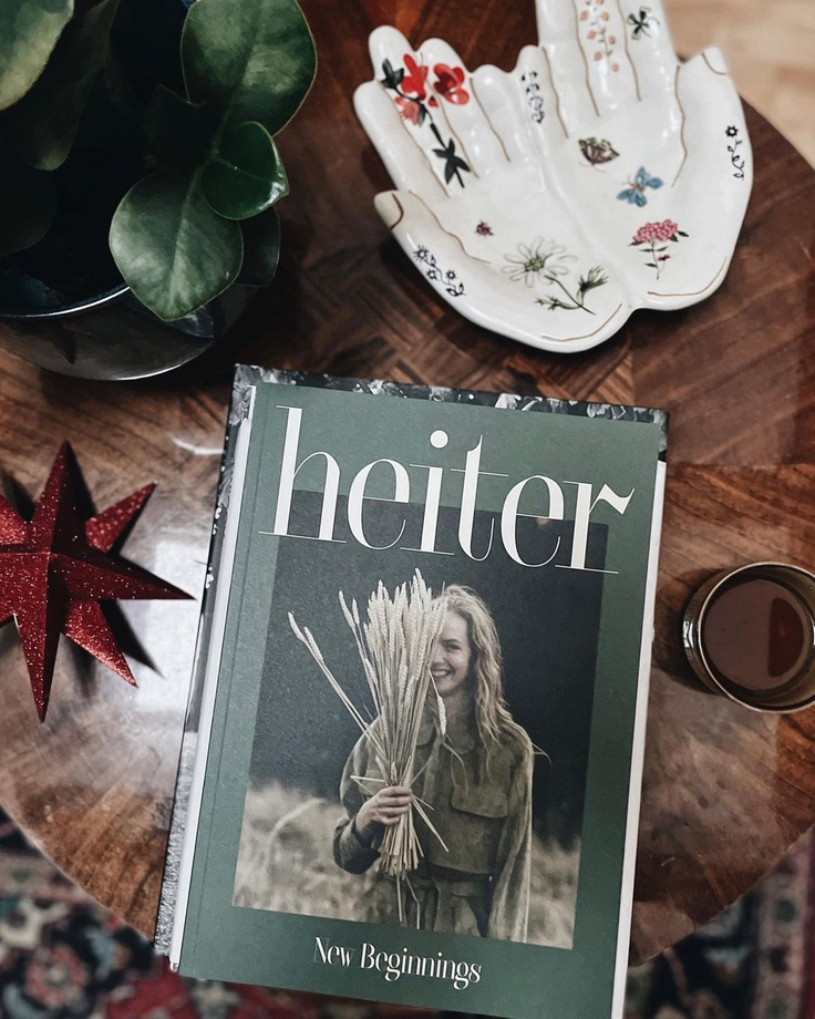 heiter magazine first print issue on table - Sustainable gift guide by Curly Carrot Pinterest marketing